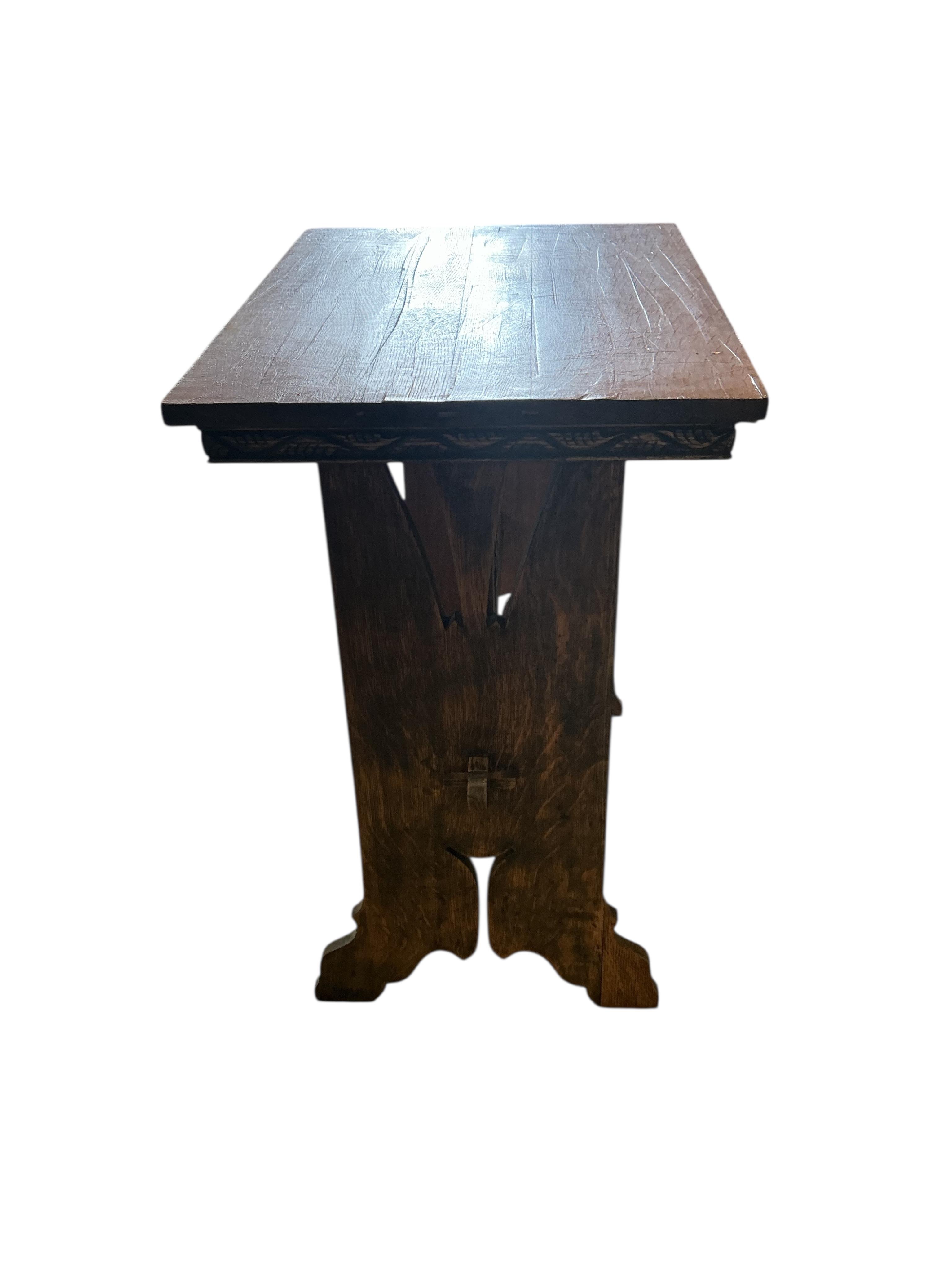 An Arts & Crafts style rectangular oak occasional table, width 63cm, depth 46cm, height 73cm